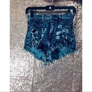 Distressed dark wash denim shorts .